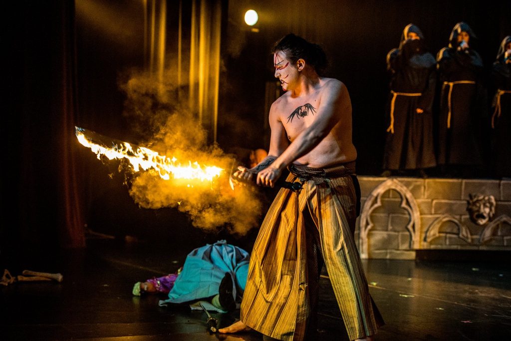 Hiromi as the flaming sword-wielding Fire General, Sanbou, in the fantasy rock opera Aeterno Elementum. 
